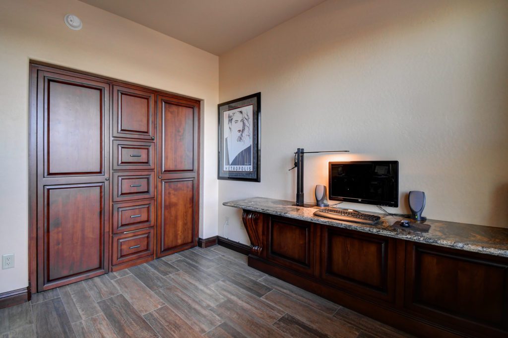 A television and cabinet in the corner of a room.