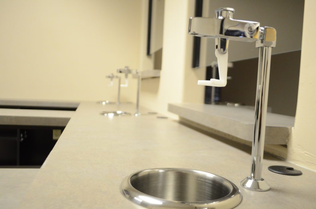 A bathroom with two sinks and a mirror