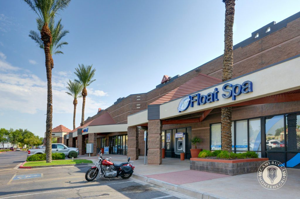 A motorcycle parked in front of a store.