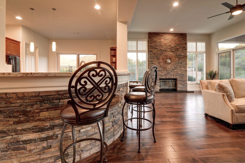 A room with two chairs and a fireplace.