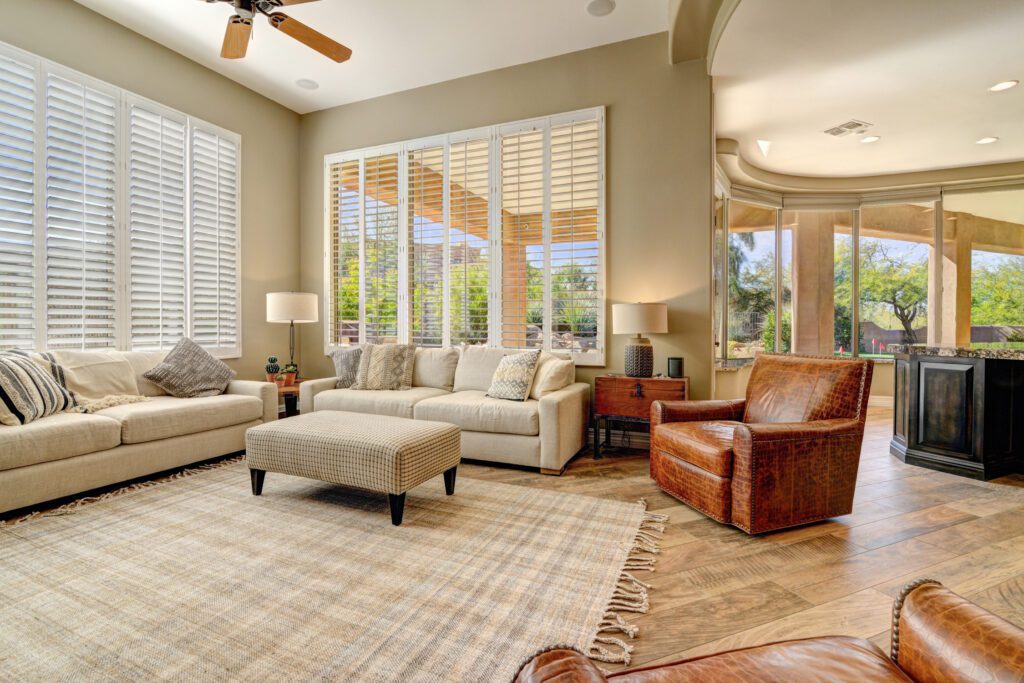 A living room with two couches, a chair and a table
