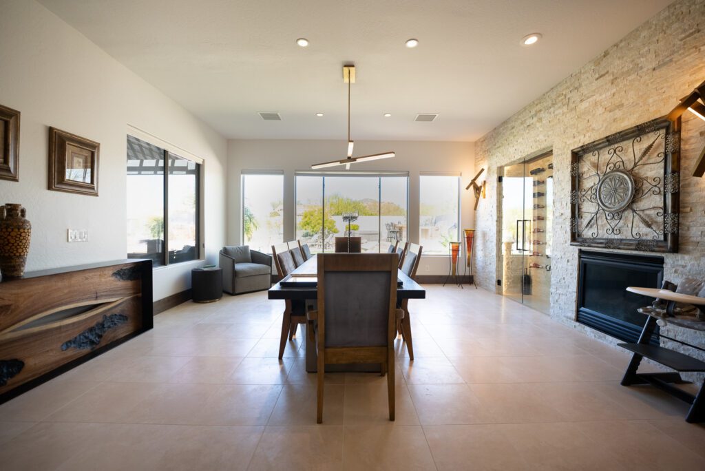 A dining room with a table and chairs in it