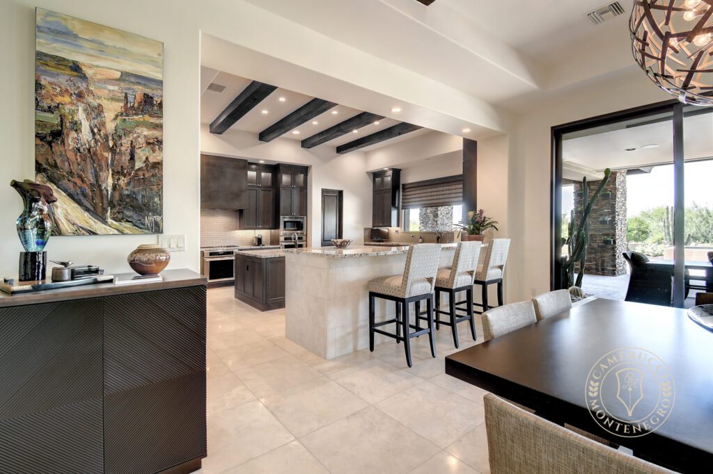 A kitchen with a dining table and chairs
