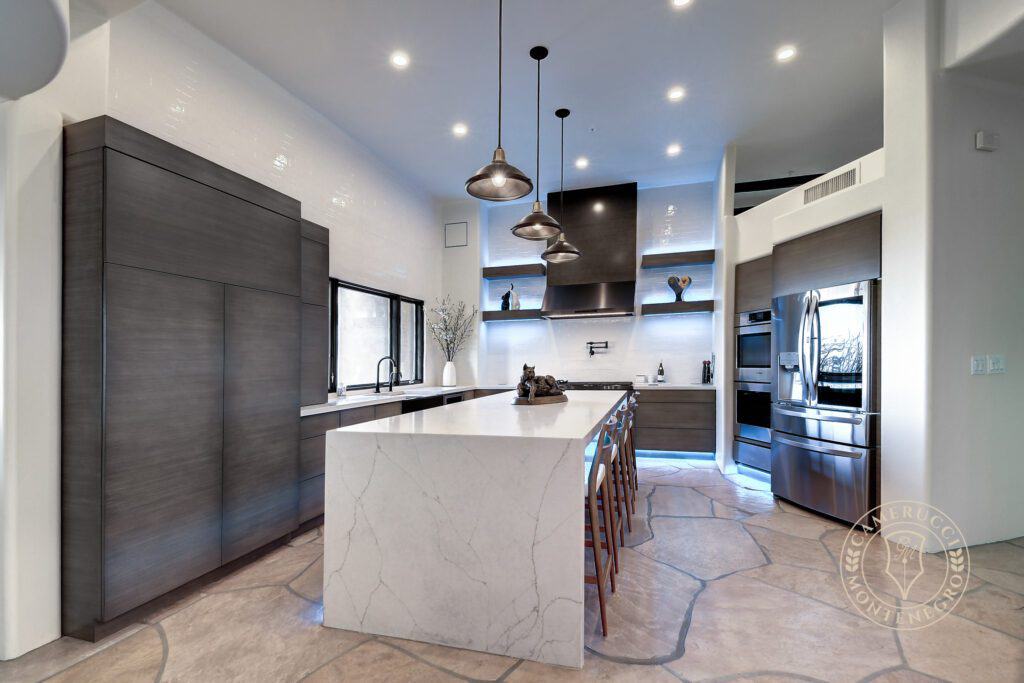 A kitchen with a large island and a lot of counter space.