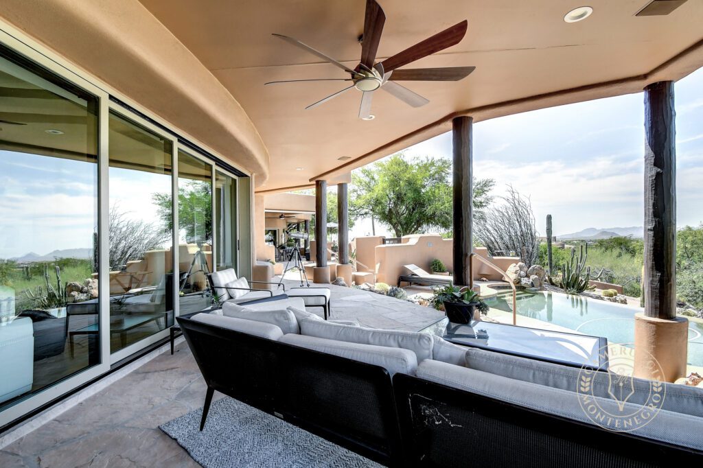 A patio with a couch and table in it