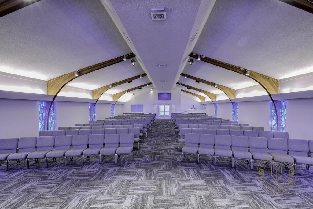 A large room with many rows of chairs.